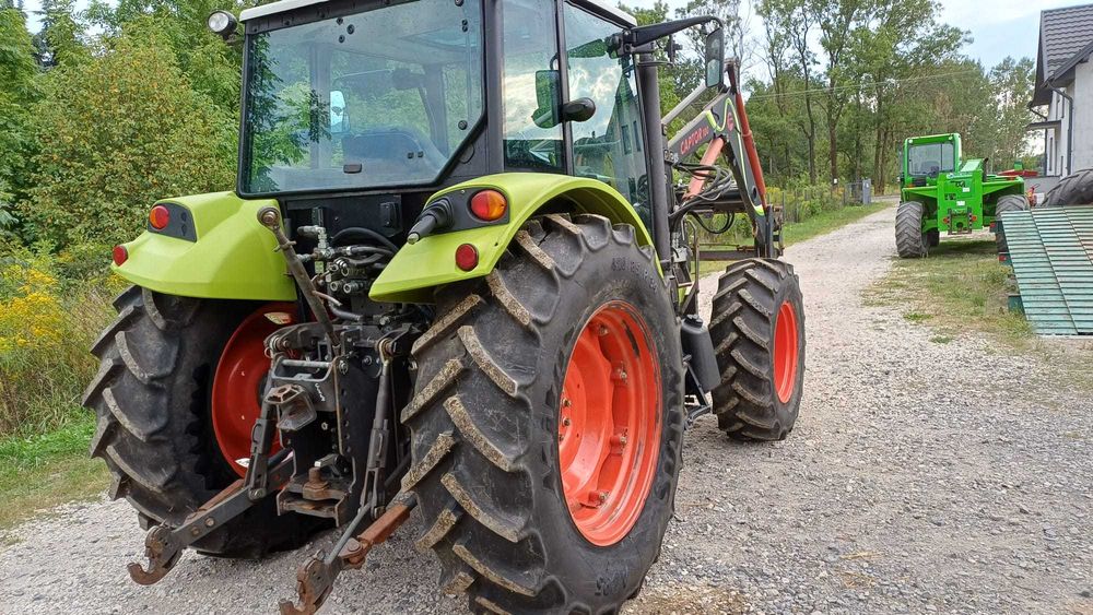 Claas Axos 320 z ładowaczem czołowym Faucheux Captor 100