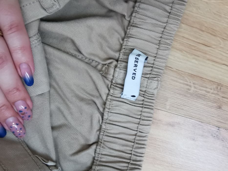 Spodnie beżowe Reserved