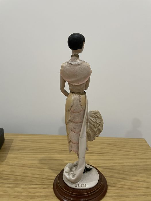 Estatueta de mulher