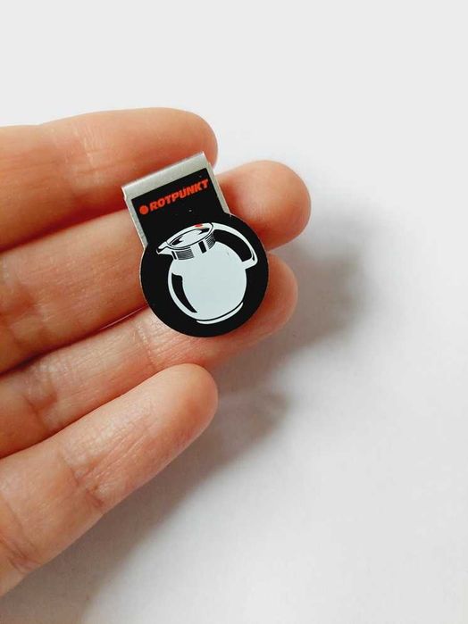 Metalowa zakładka do książki / metalowy klips magnetyczny małych rozmiarów z graficznym motywem dzbanuszka.