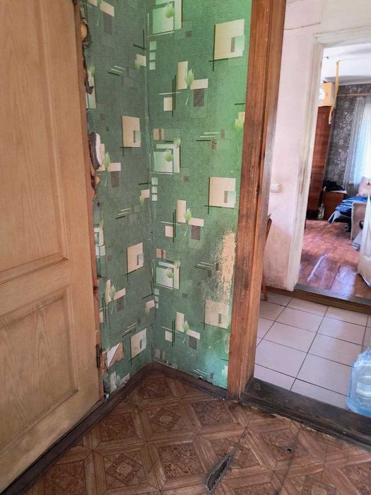 Продам 1/2 дома в центре Змиева