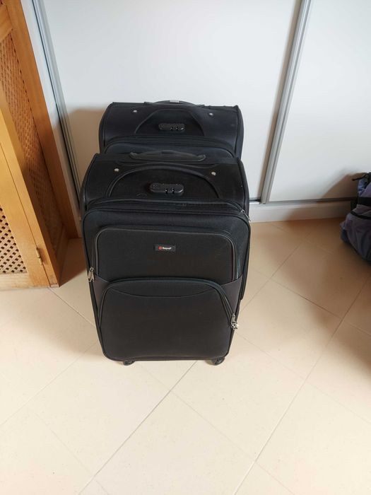 2 large black suitcases.