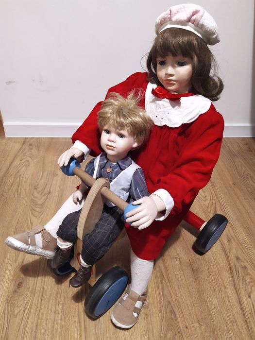 2 lalki porcelanowe kolekcjonerskie plus rowerek