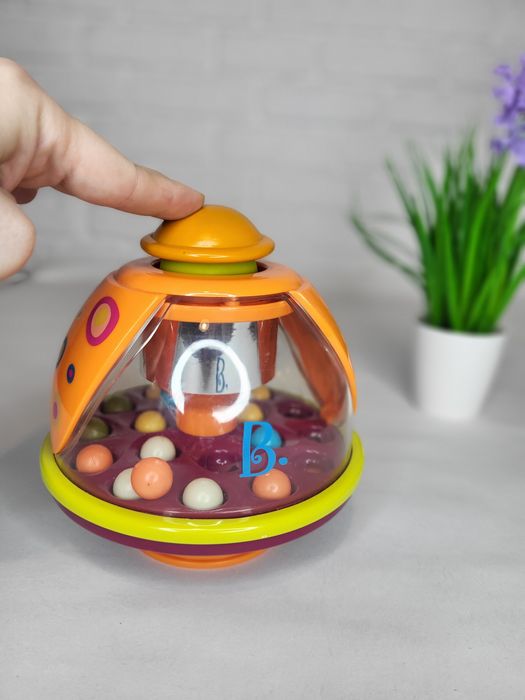 Іграшка дзиґа-мандаринка Battat