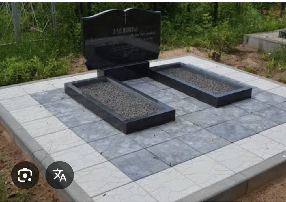 Укладання бруківкою навкруг  пам'ятників