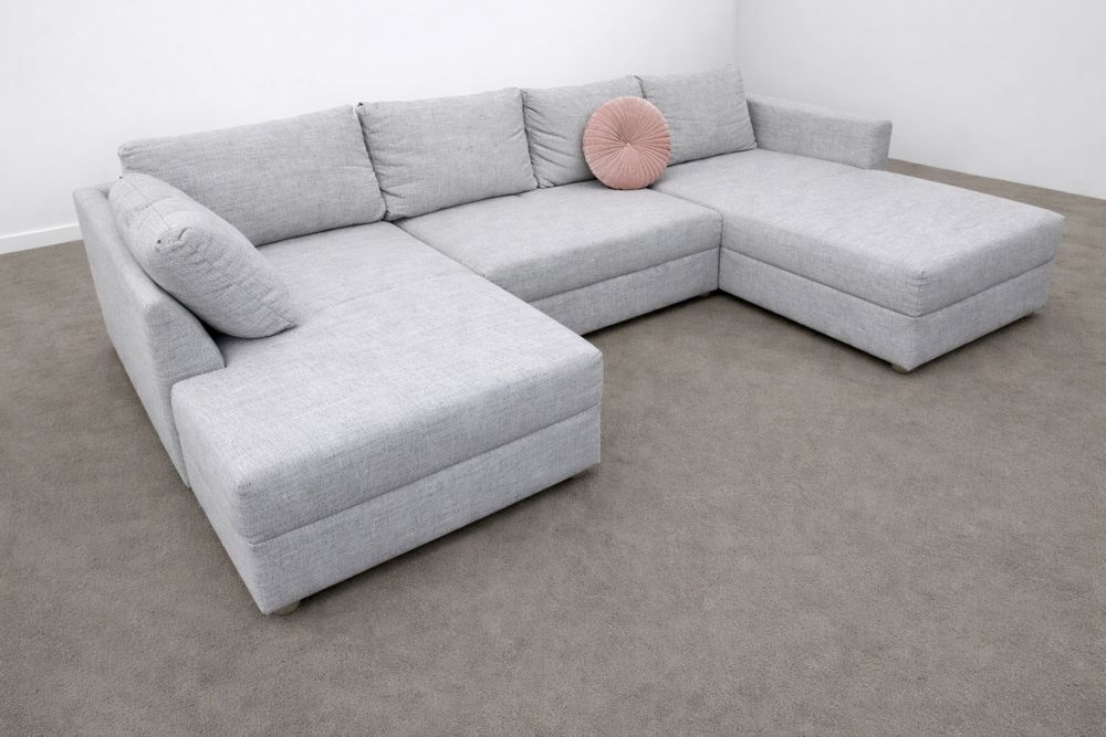 Szary używany narożnik w kształcie litery U z funkcją spania rozkładan