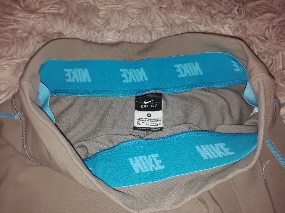 Damskie spodnie sportowe Nike Dri-Fit 3/4 rozm. XL