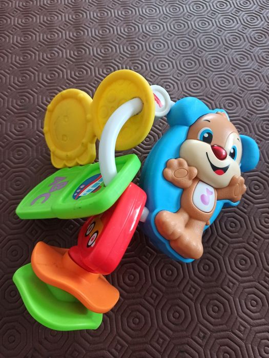 Chaveiro cãozinho fisher price para bebé
