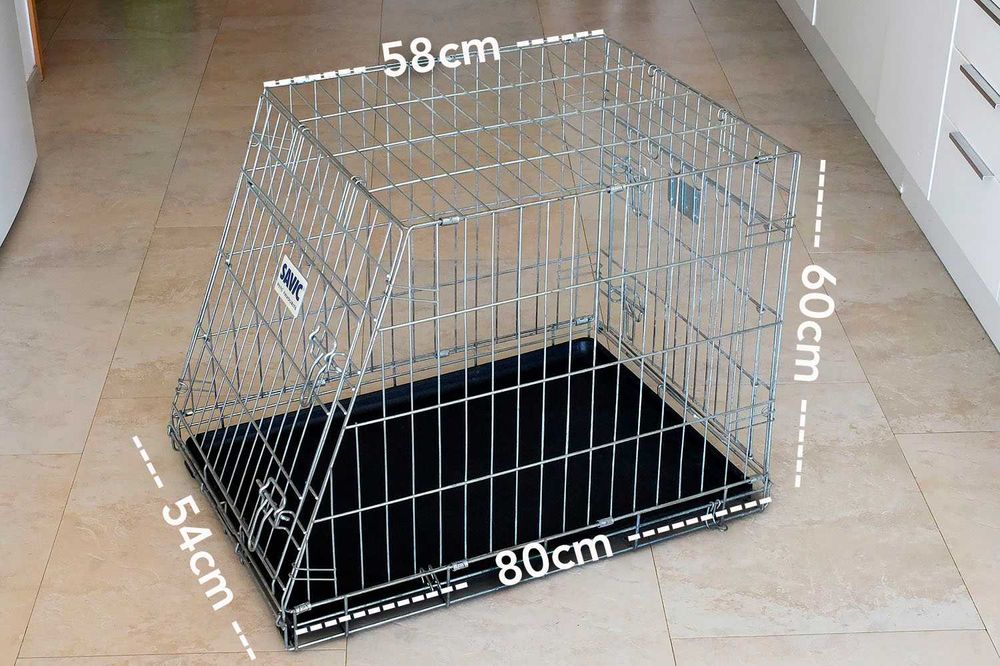 Jaula de transporte e viagem para cão de porte médio.