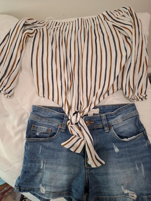 Conjunto calção de gang e blusa ombro a ombro
Calção Tamanho 34 marca Springfield 
Top ombro a ombro Tamanho S marca Pull&Bear