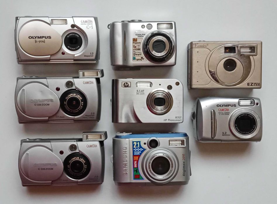 Цифровые фотоаппараты HP Photosmart R707. Olympus. Nikon, Samsung Digimax 200