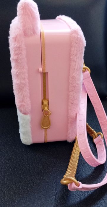 Boneca Na Na Na mochila surpresa 3 em 1.