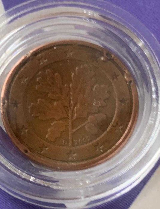 Moeda de 1 cêntimo achado rar0 de 2002, com erros de cunhagem.