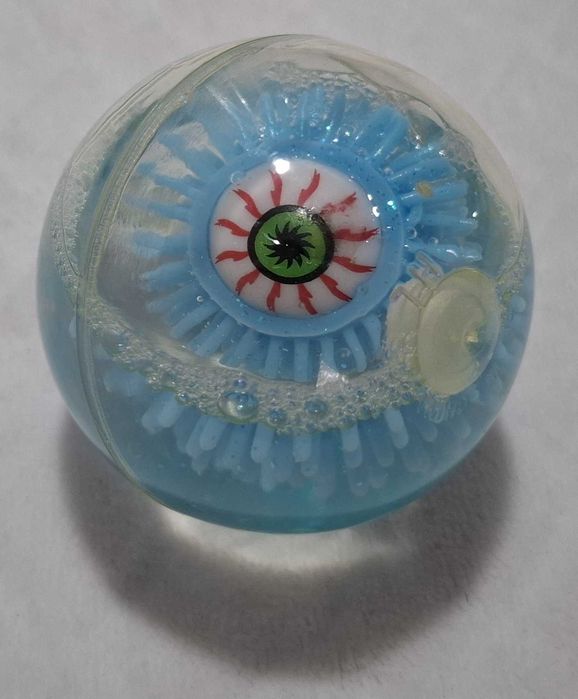 Gumowa kulka z okiem, brokatem, niebieska, 6cm (Zabawka)