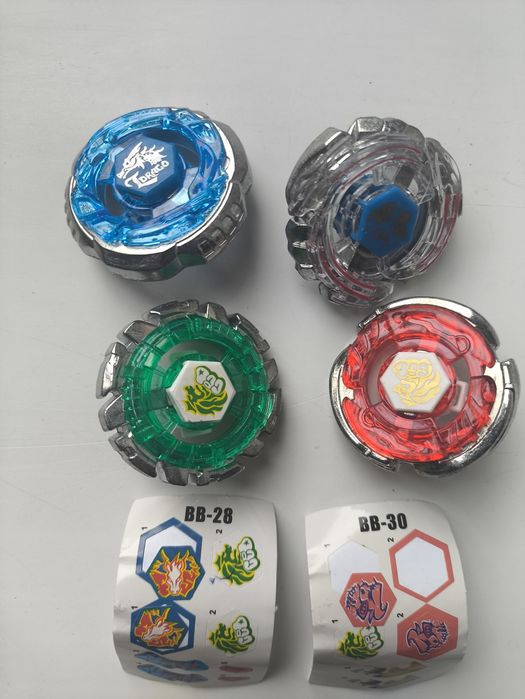 Лот блейдів 4 шт з наклейками /Beyblade