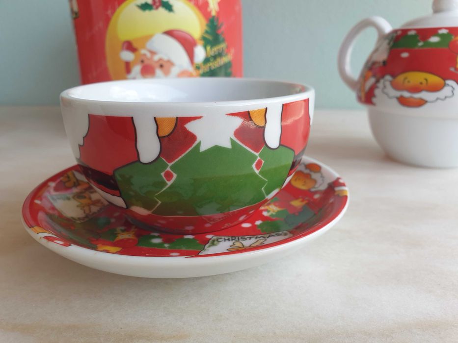 Conjunto de bule e chávena com motivos de Natal