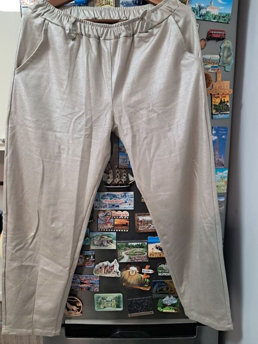 Spodnie damskie livans ze złotą poświatą