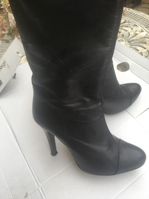 Botas de Cano e salto alto