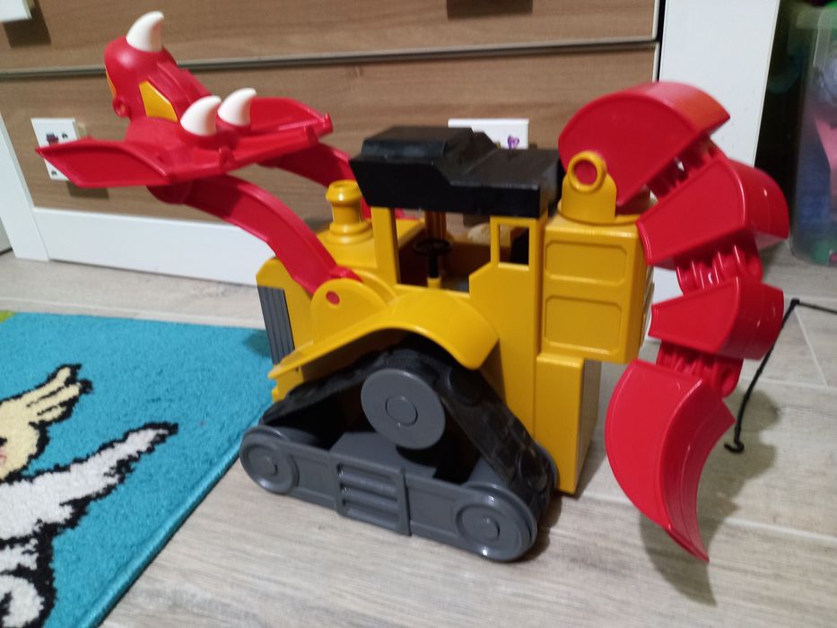 Koparka , spychacz, dinozaur, triceratops jak nowa