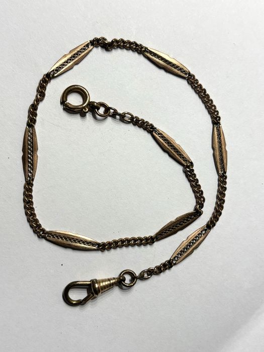 Antigas correntes de relógios de bolso em metal dourado