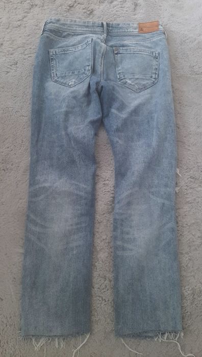 H&M  spodnie jeansowe rozdarcia niebieskie