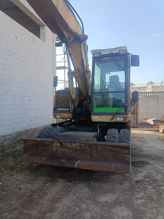 Екскаватор Caterpillar M312