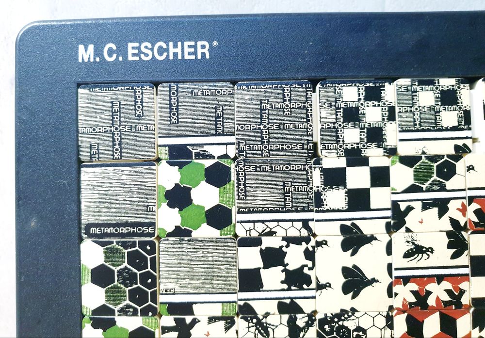 M.C. Escher "Metamorphose" Quebra cabeça deslizante