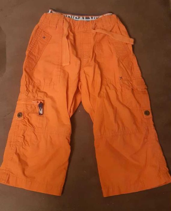 Pomarańczowe spodnie sportowe dla chłopca H&M 92