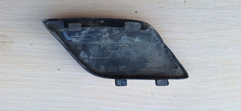 Заглушка омывателя фар Опель астра Н левая