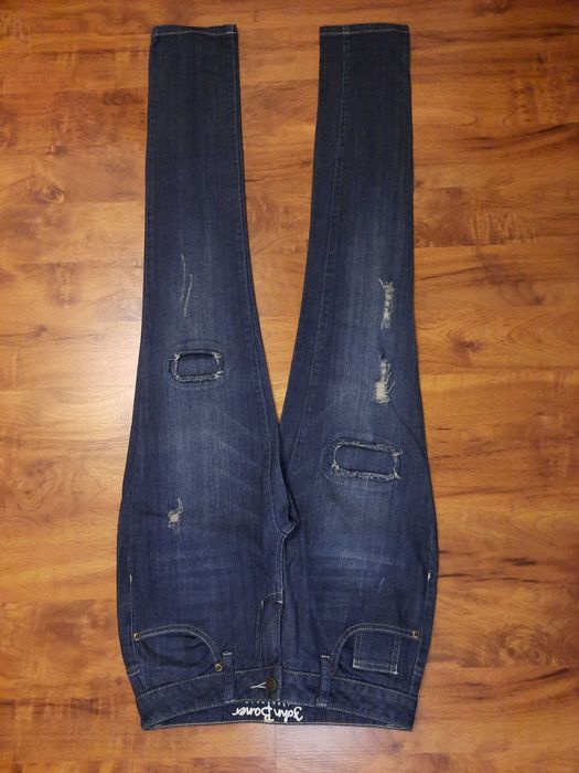 Spodnie jeansowe z dziurami i przetarciami jeansy John Baner 34 XS