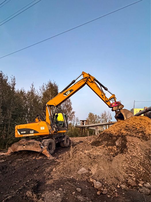 Wynajem koparki kołowej  CAT M318D  18 t z  podnoszoną kabiną