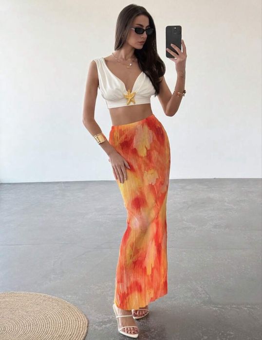 Плісирована спідниця з яскравим абстрактним принтом