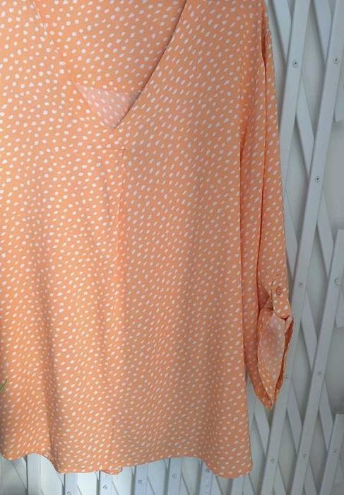 Blusa com modelagem fluída e jovial que dentro da sua simplicidade transita para um look casual - Tam - XXL    Modalfa
