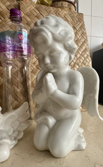 Par de anjos da guarda em porcelana