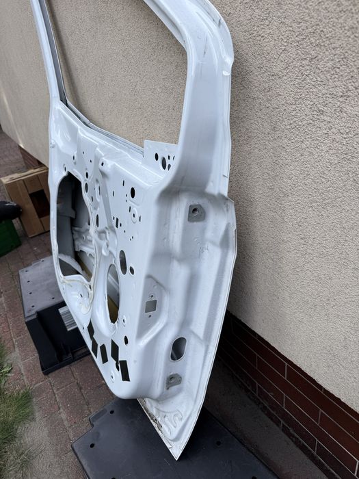 Ford transit courier MK2 drzwi lewe przód OE