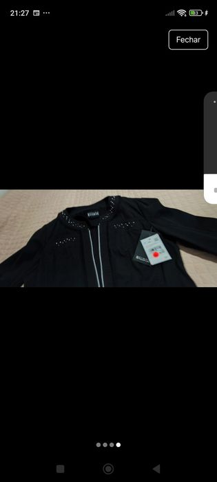 Blusas preto com fecho.