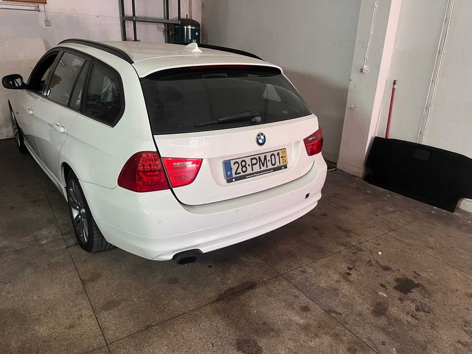 Selling a white BMW station wagon