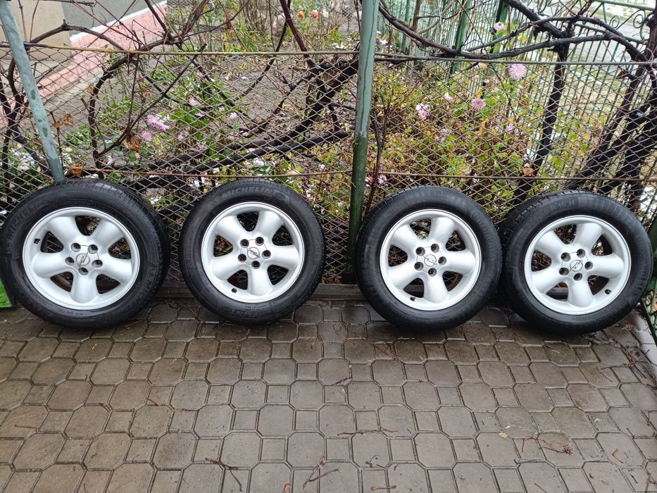 Диски титани з резиною  опель GM Opel 5/110 R16 (7Jx16 ET39) оригінал
