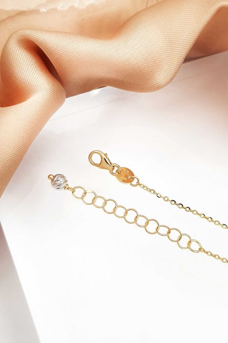 Złota celebrytka z okrągłą diamentowaną kulką z białego złota pr.585