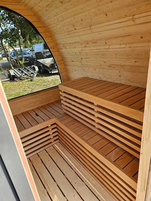 Sauna ogrodowa z piecem opalanym drewnem panorama oświetlenie