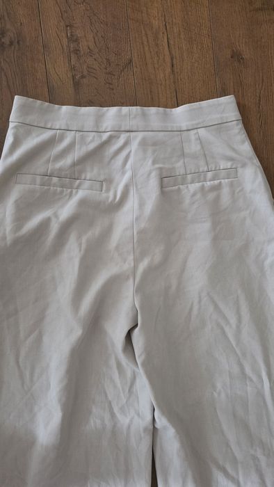 Spodnie eleganckie szeroka nogawka beżowe H&M