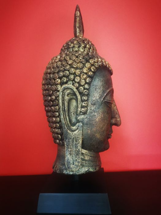 Escultura rosto Buda