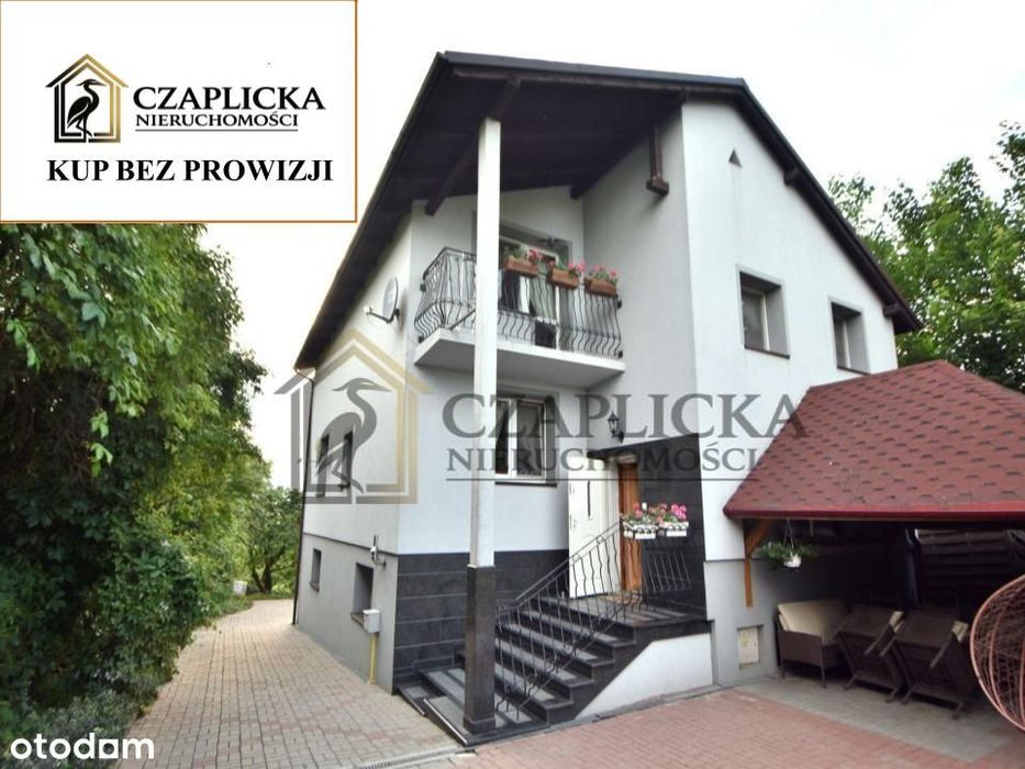 Dom wolnostojący przy jeziorze z dwoma garażami - po remoncie