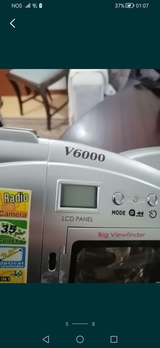 Câmara de filmar da marca Olympia + telefone fixo.