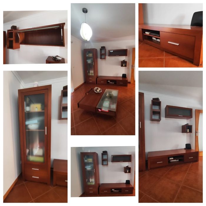 Sala completa com móveis de parede, TV, chão e centro.