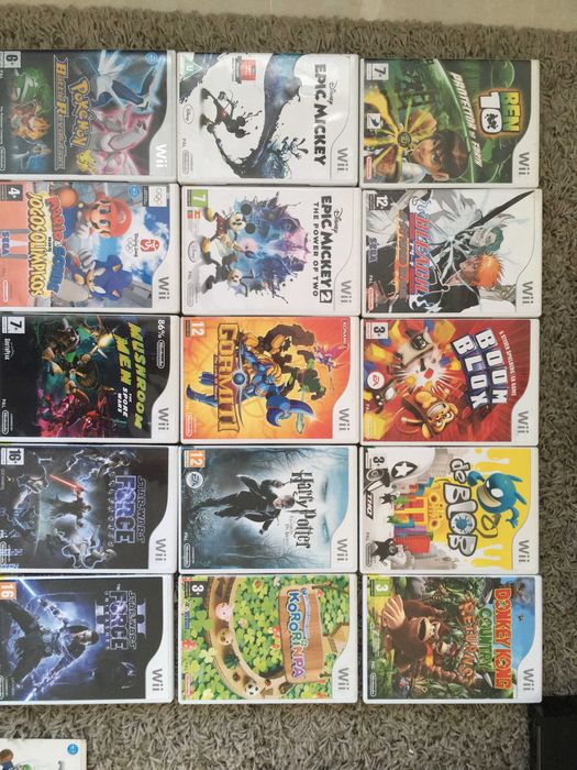 2 Wii Consoles + 2 Steering Wheels + 21 Games64564135964545122