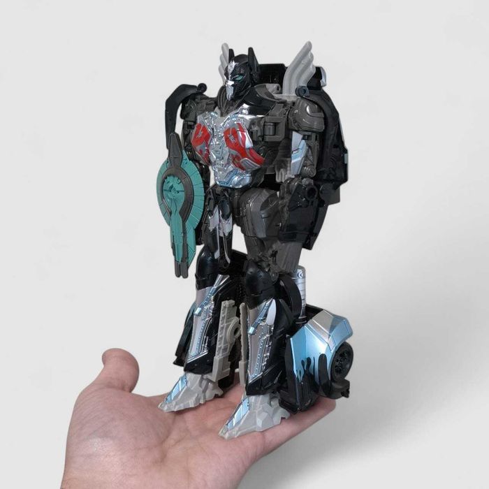 Іграшка-трансформер Оптімус Прайм Nemesis Prime 23см, Робот-вантажівка