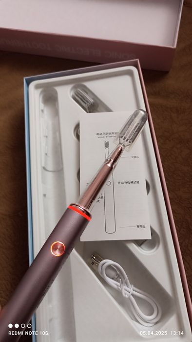 Нова електрична зубна щiтка.