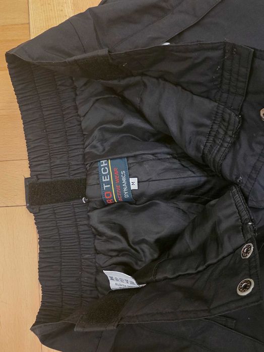 Czarne spodnie sportowe marki Protech Activewear Dynamics.