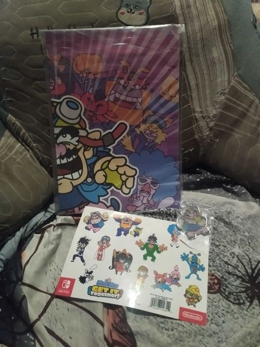 Orginalny Pooster/plakat Nintendo Warioland+ breloczek + naklejki
